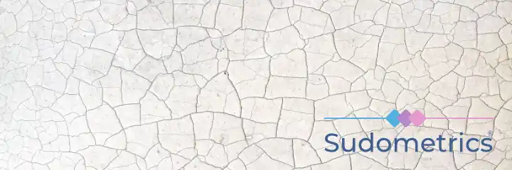 A cracked and dried river bed with the Sudometrics logo overlaid
